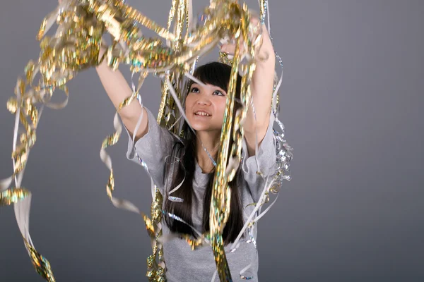 Girl with tinsel — Stock Photo, Image