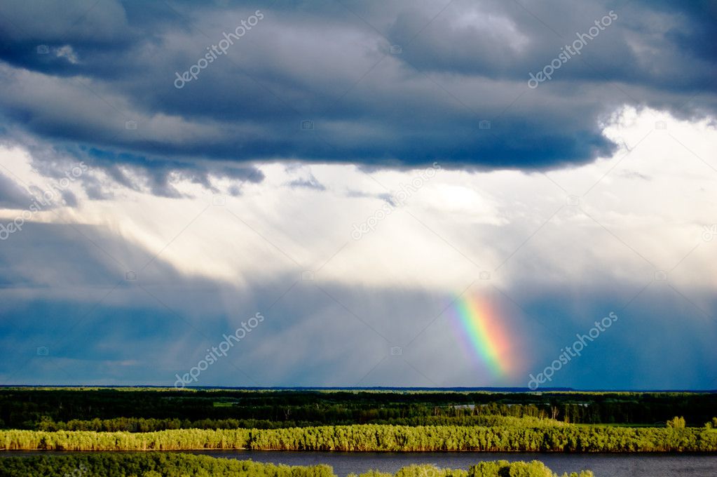 Cloudscape with beautiful rainbow.