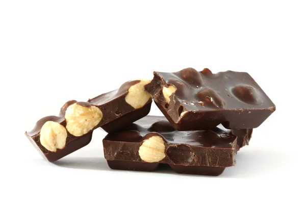 Dark chocolate with whole hazelnuts — Stock Photo, Image