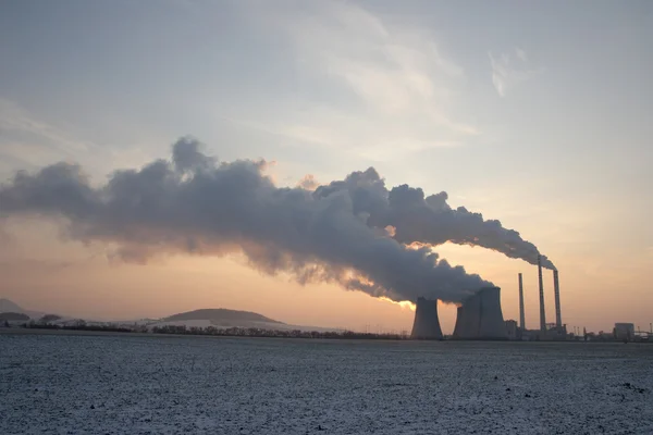 Coal powerplant against sun rise — Stock Photo, Image