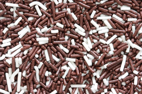 Background of brown and white sprinkles — Stock Photo, Image