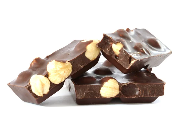 Dark chocolate with whole hazelnuts — Stock Photo, Image