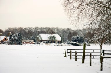 Dutch farm in the snow clipart