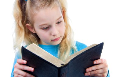 Little girl is reading the Bible clipart