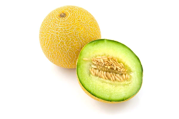 Hele en halve gele meloen — Stockfoto