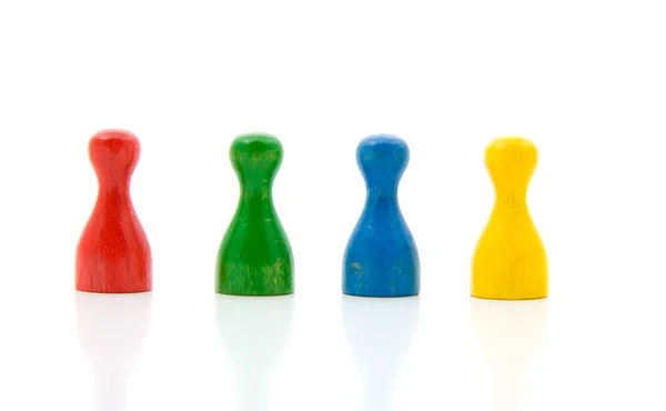 Four colorful pawns — Stock Photo, Image
