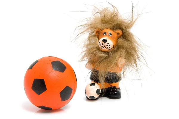 Orange soccer ball and lion — Stock Photo, Image