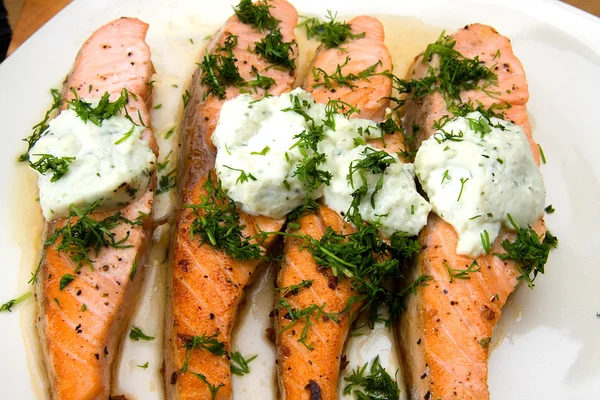 Grilled salmon with cheese and herbs — Stock Photo, Image
