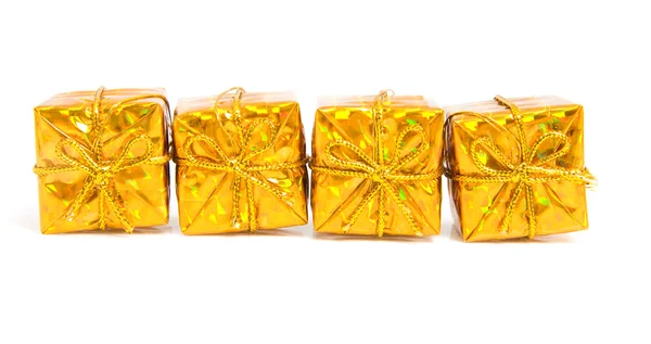 Presentes brilhantes dourados — Fotografia de Stock
