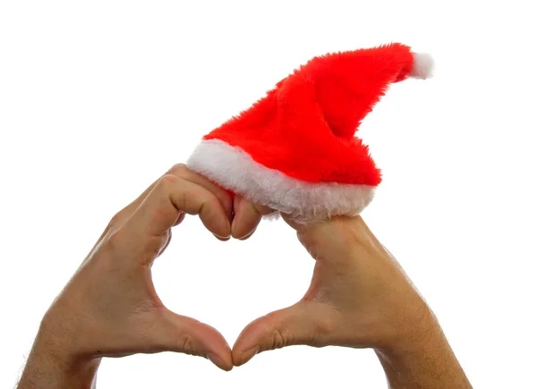Χέρια καρδιά σχήμα με καπέλο Χριστούγεννα — Φωτογραφία Αρχείου
