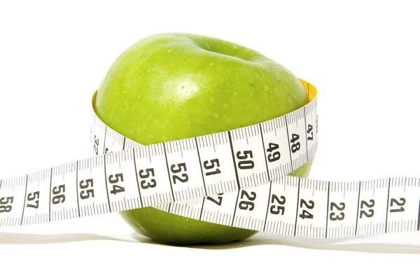 Green apple with measure-tape — Stock Photo, Image