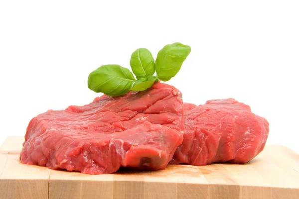 Raw steak on cutting board — Stock Photo, Image
