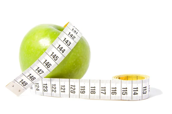 측정 테이프를 가진 녹색 사과 — 스톡 사진