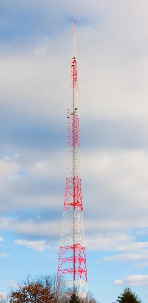 stock image Very Tall Antenna Tower in Sky Clouds