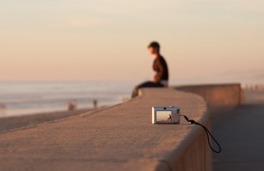 Sunset Beach Man Sitting Alone clipart