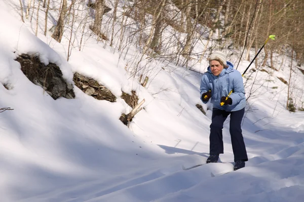 stock image The elderly woman on skis