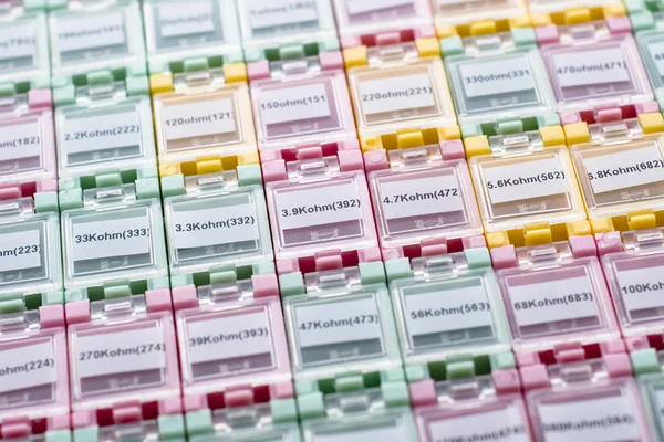 Colorful boxes filled with resistors — Stock Photo, Image
