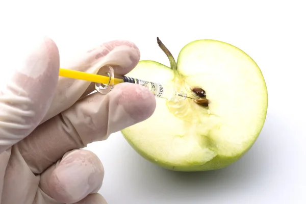 stock image Sliced green apple injected with
