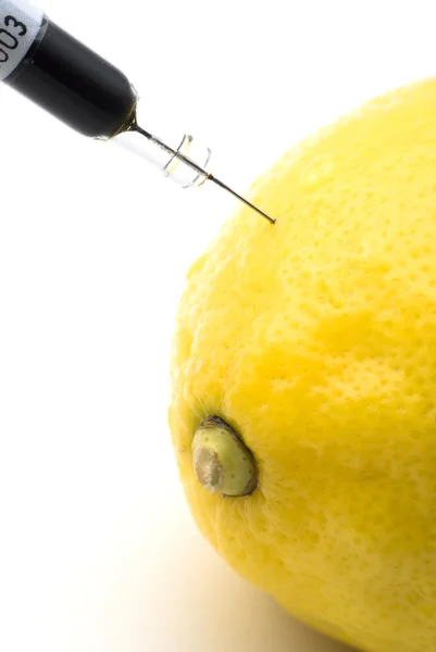 Stock image Lemon injected with chemicals