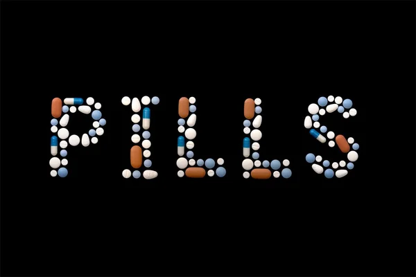 Slovo pilulky s prášky — Stock fotografie