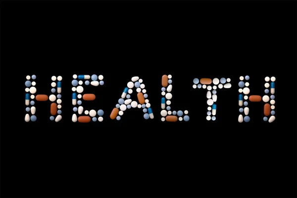 Palavra saúde escrita com pílulas — Fotografia de Stock