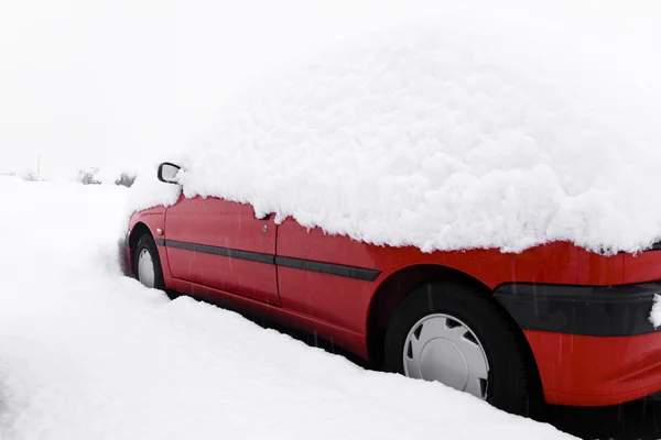 Snowbound red car — Stock Photo, Image