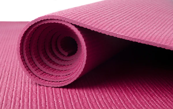 Розовый коврик для йоги — стоковое фото