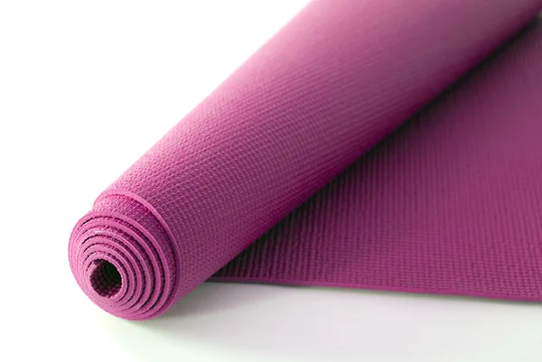 Розовый коврик для йоги — стоковое фото