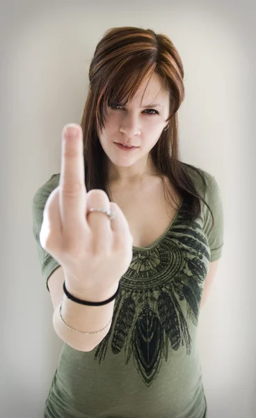 Angry woman with middle finger up — Stock Photo, Image