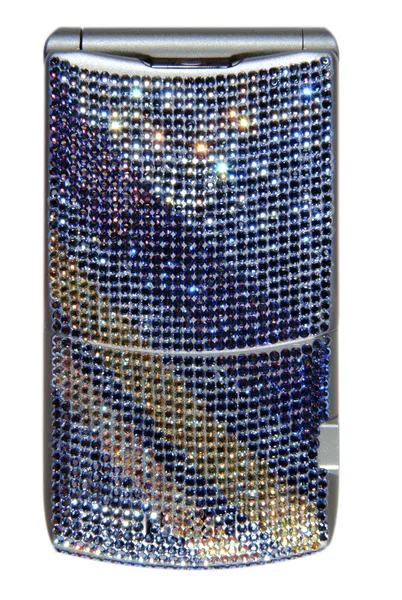 Mobiltelefon täckt med kristaller Stockbild