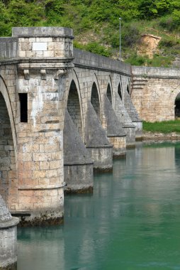 Ancient stone bridge in Visegrad clipart