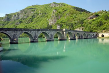 Old stone bridge in Visegrad clipart