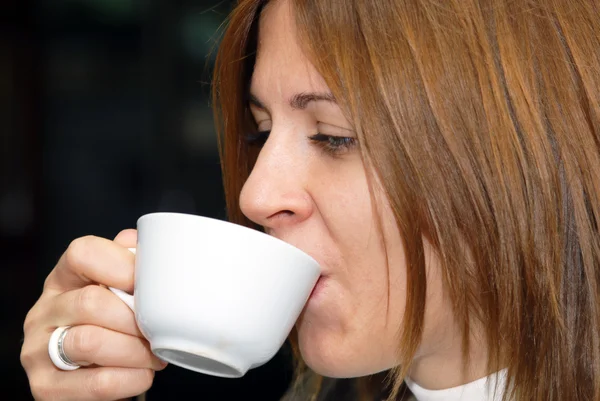 Female enjoying a cup of coffe — Stock Photo, Image