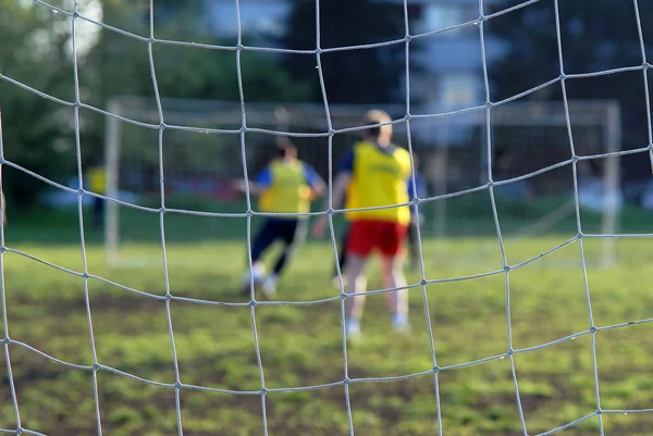 stock image Soccer players in front of net