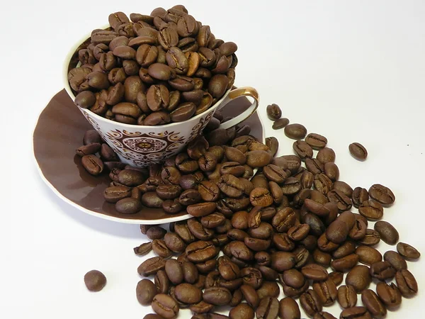 Cup with coffee beans — Stock Photo, Image