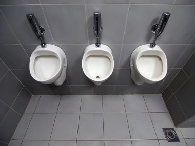 3 urinals in men's room clipart