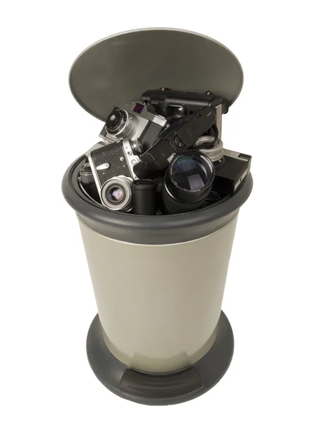 Old cameras in a garbage bin — Stock Photo, Image