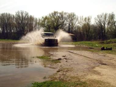 4x4 driving through river clipart