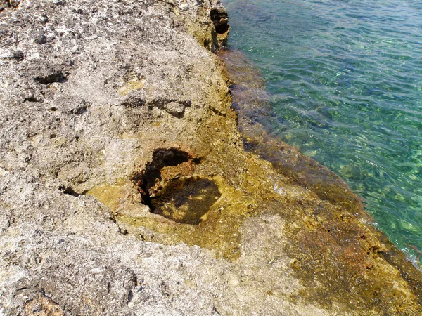 stock image Rocky sea shore and beautiful clear sea