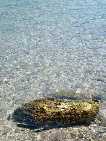 Single rock on sandy beach — Stock Photo, Image