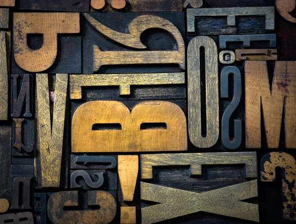 Hintergrund der alten Holzbuchstaben — Stockfoto
