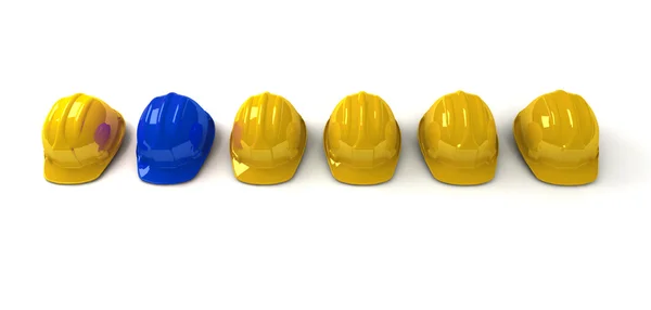Blue hardhat among yellow ones — Stock Photo, Image