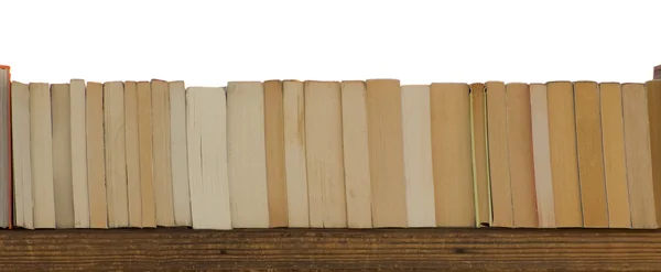 Böcker på en planka — Stockfoto