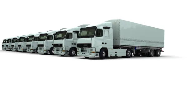 Восемь белых грузовиков подряд — стоковое фото