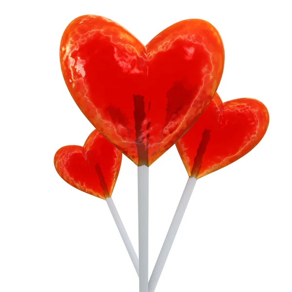 Pirulitos vermelhos em forma de coração — Fotografia de Stock