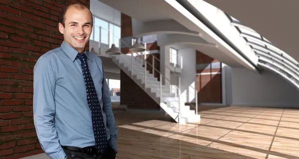 Smiling man in an expensive loft — Stock Photo, Image