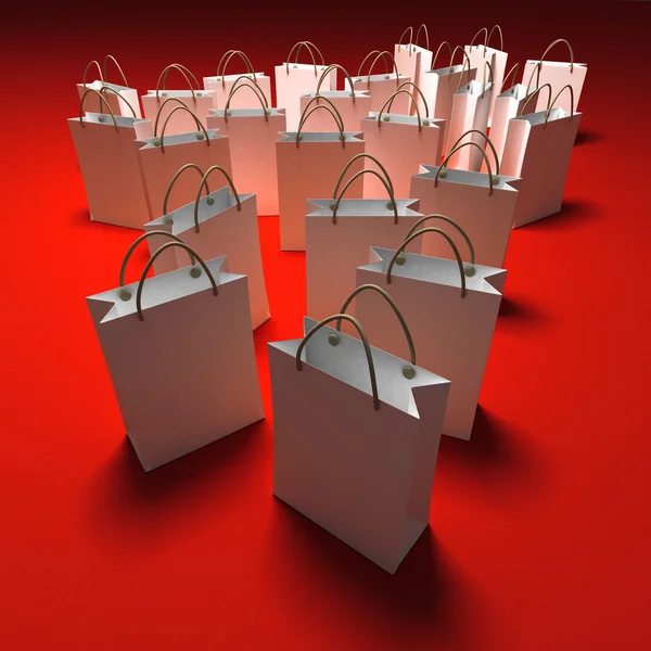 Einkaufstaschen auf rotem Hintergrund — Stockfoto