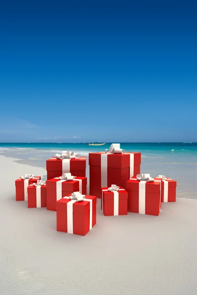 stock image Red gifts on a beach