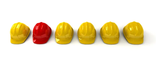 Red hardhat among yellow ones — Stock Photo, Image