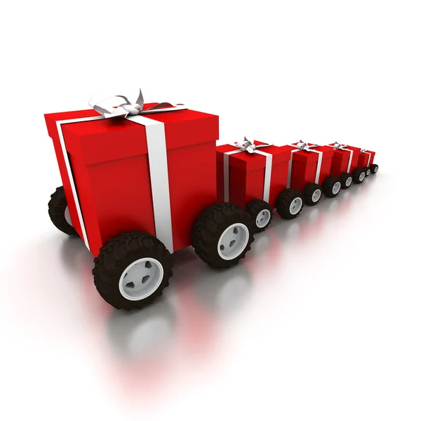 Row of red gift boxes with wheels — Zdjęcie stockowe